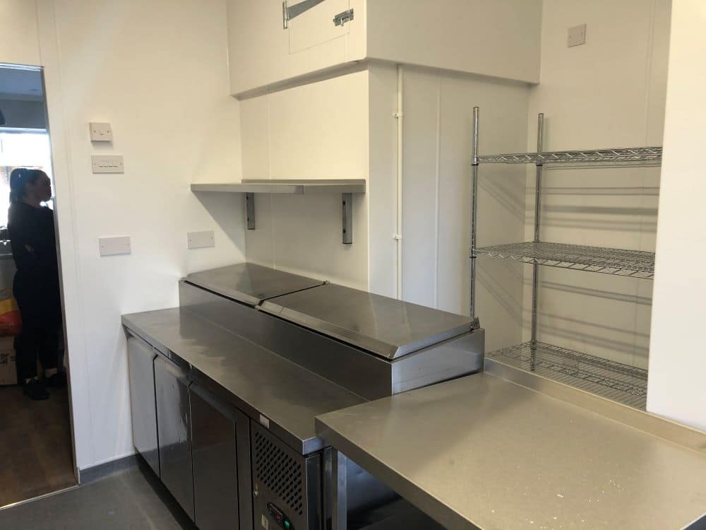 Prep area with hygienic wall cladding at Bakery 64, New Romney
