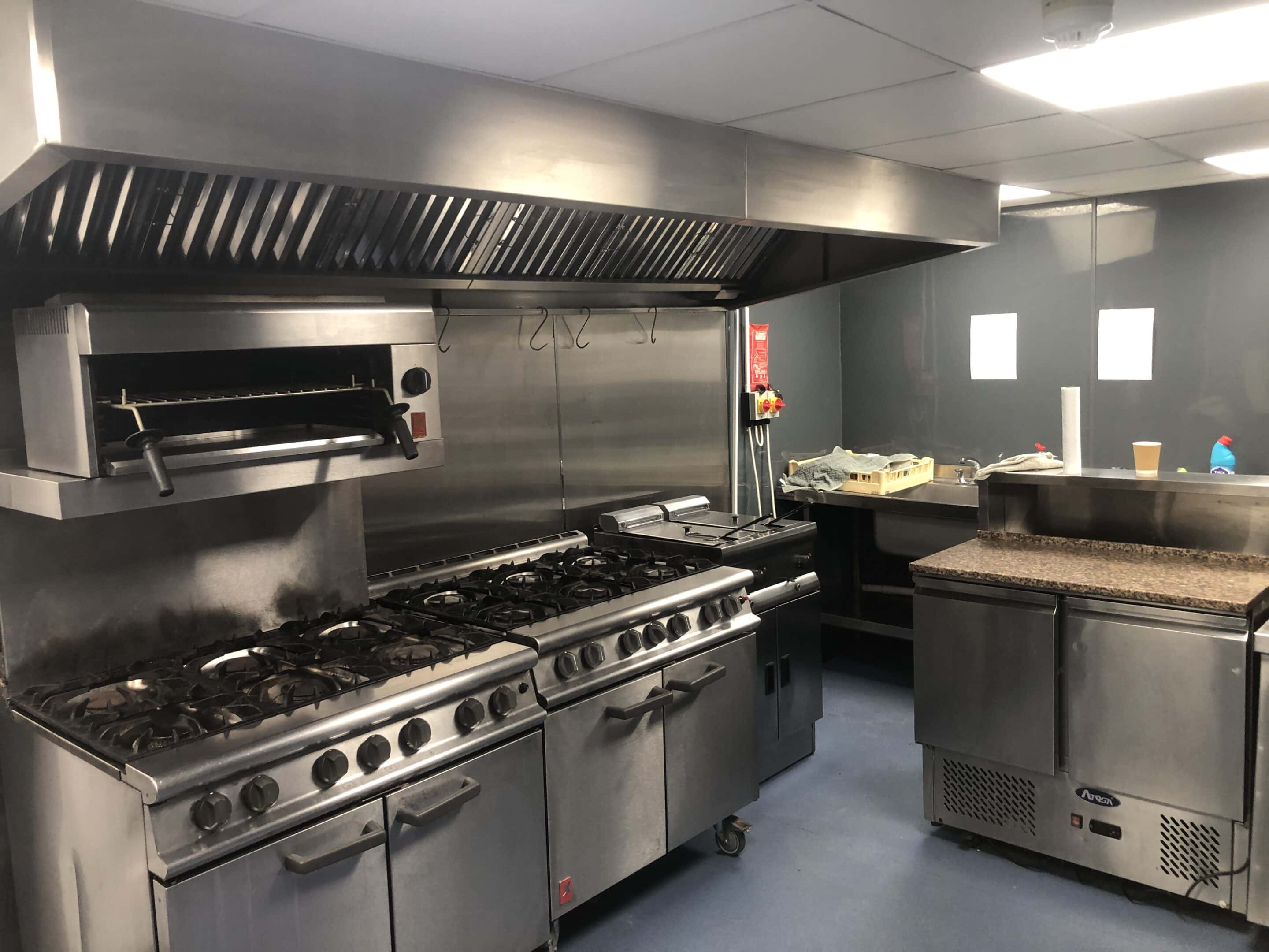 Gas range and salamander on the cookline at the Blue Pigeons