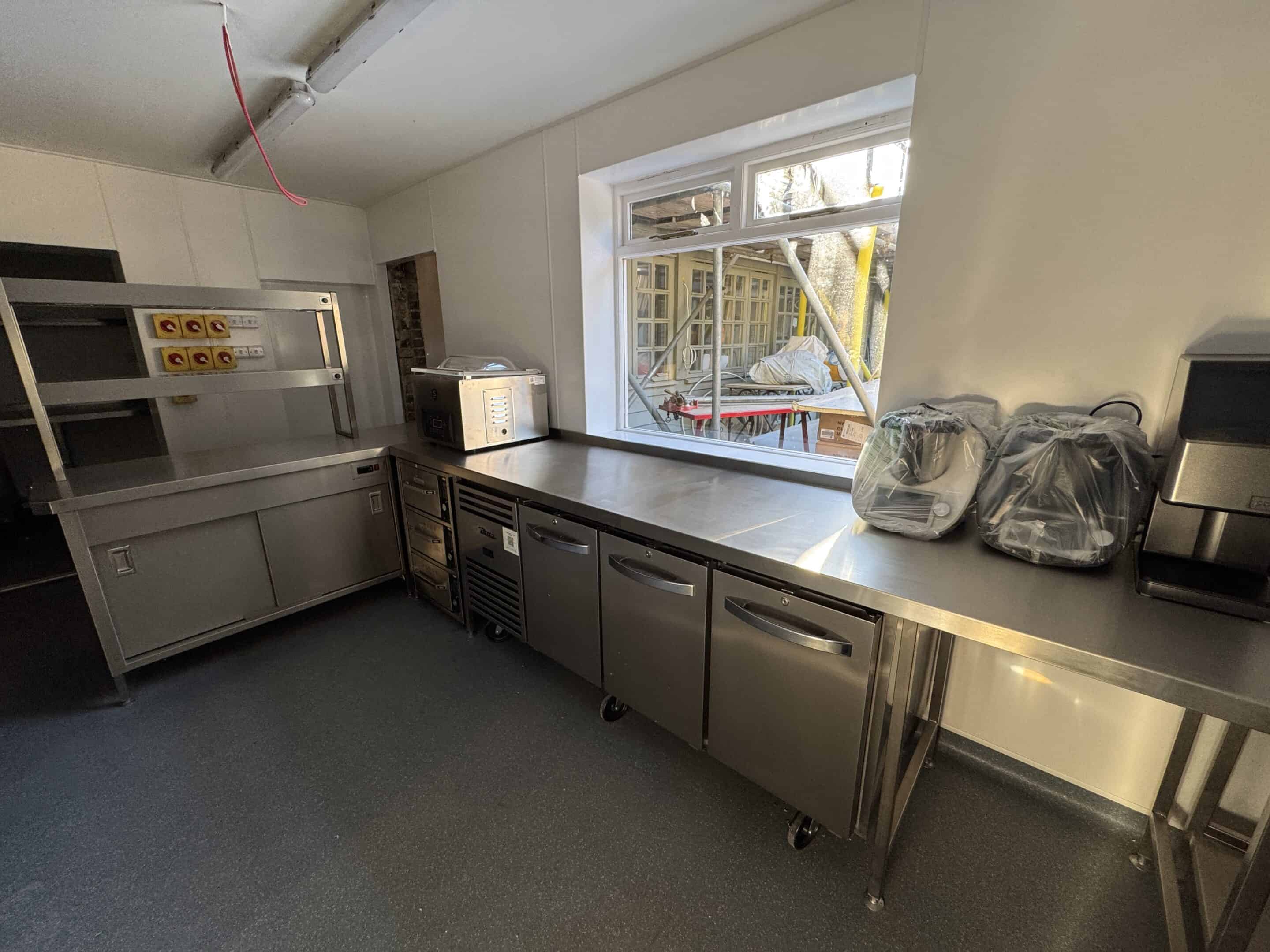 Stainless steel preparation counter in the Blue Pigeons kitchen