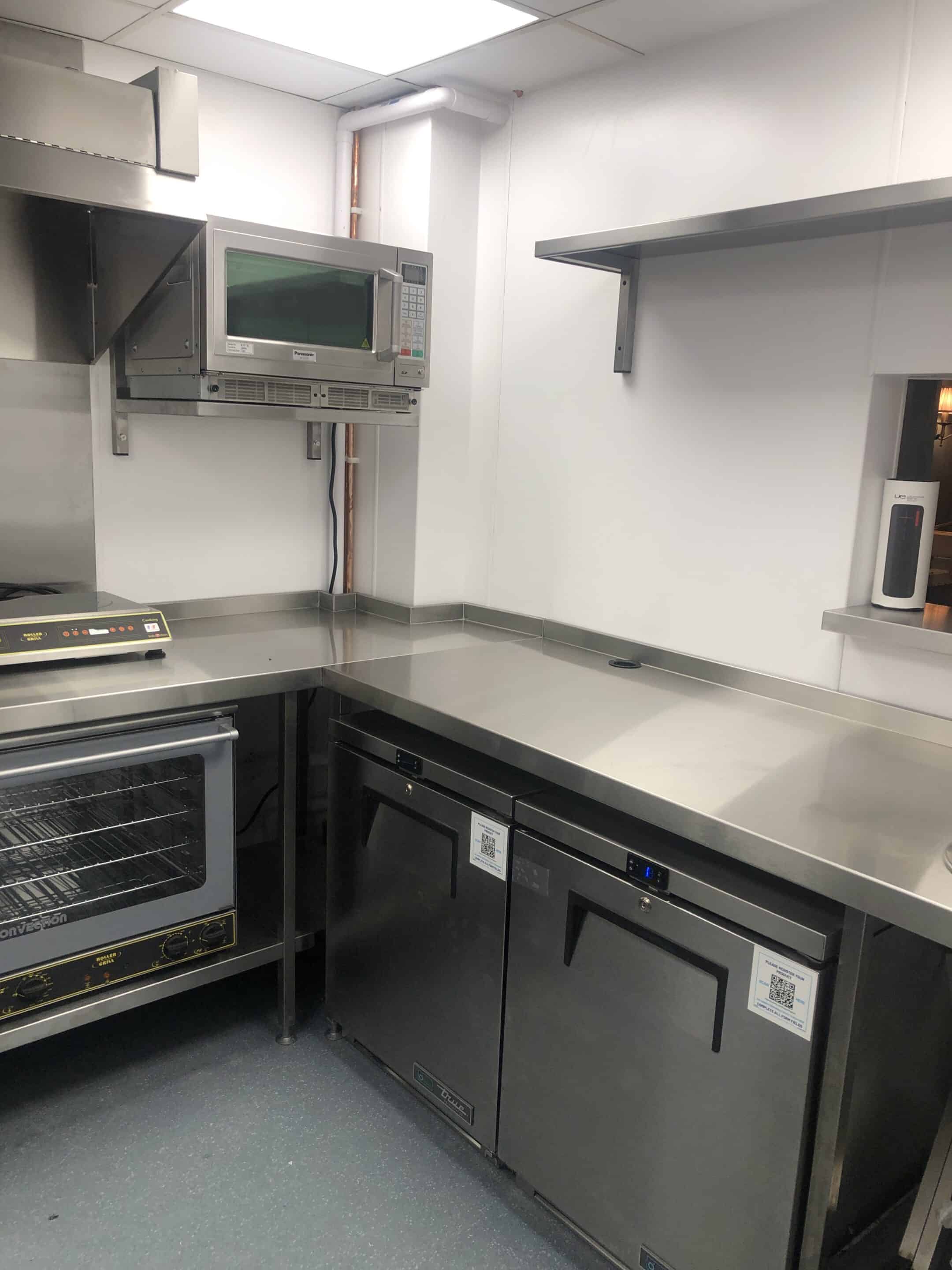 Carsons Tea House kitchen corner — cooking line and wall cladding