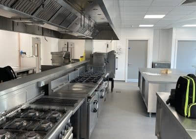 Gas ranges and cooking line in a teaching kitchen at Folkestone College