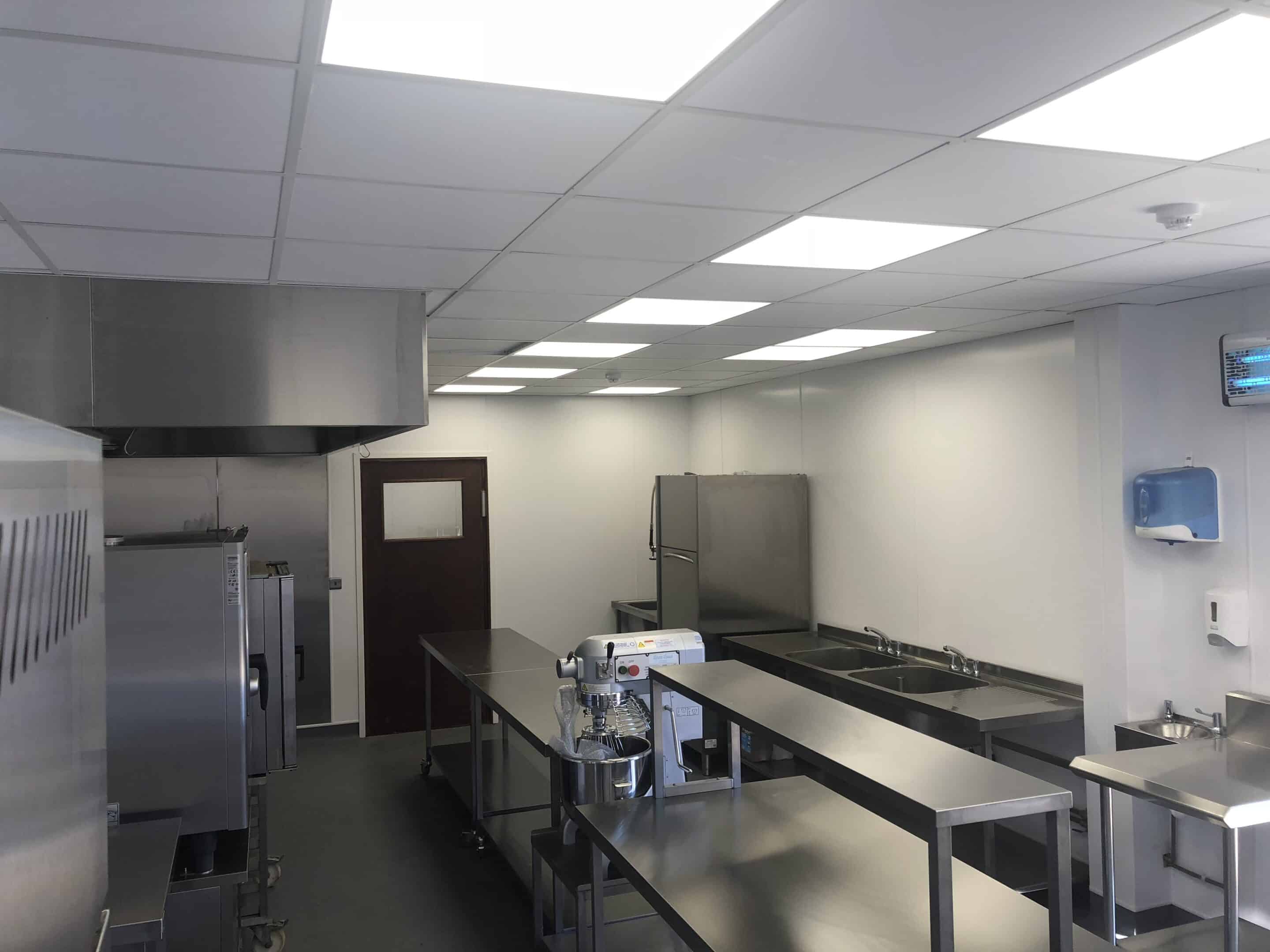Kitchen overview showing prep tables at Gibson's Farm Shop