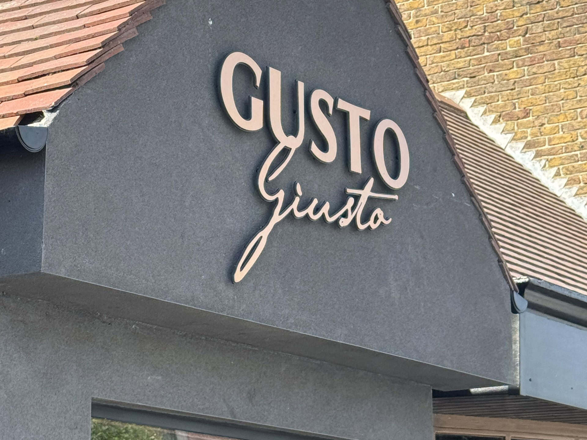 Exterior signage at Gusto Giusto, Tankerton