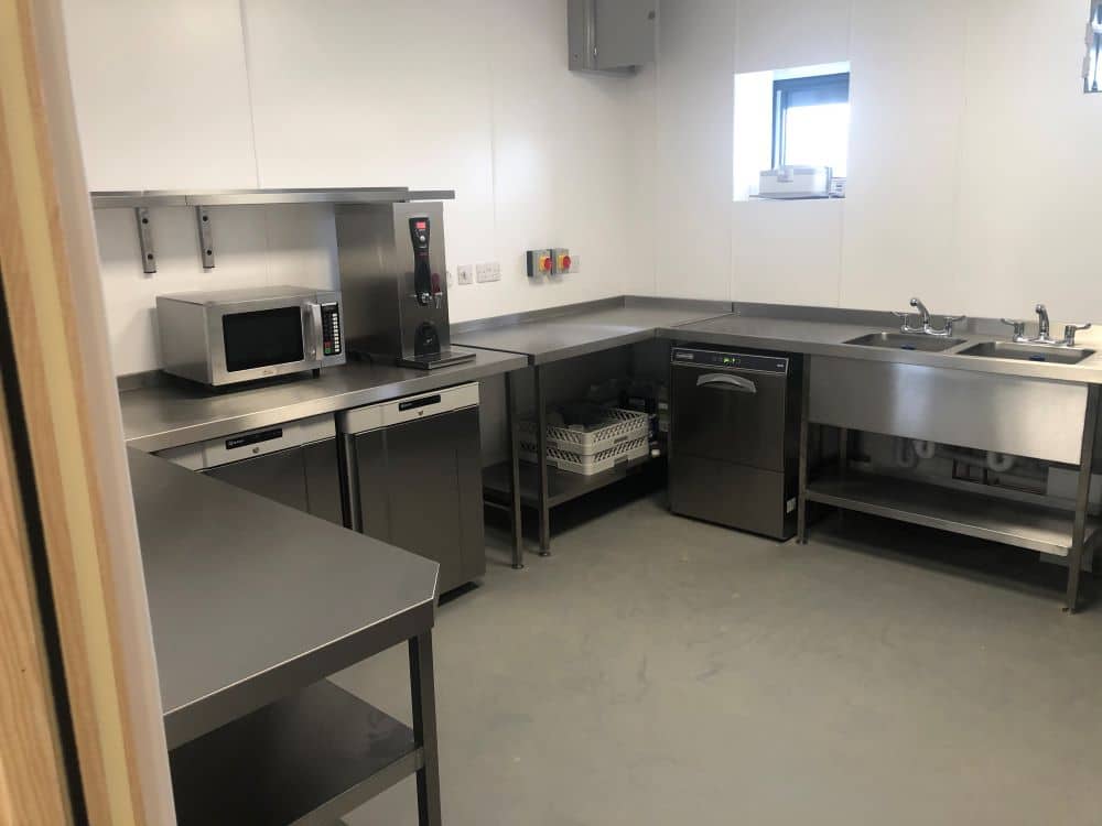 Microwave, dishwasher and sink at Herne Bay Golf Club kitchen