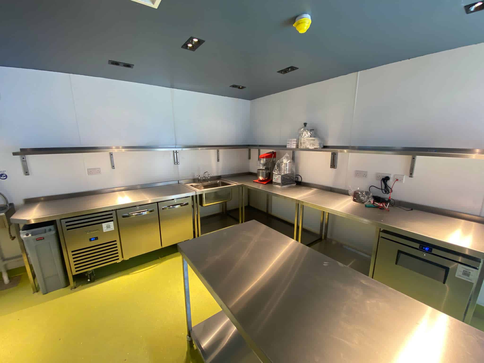 Prep kitchen with bespoke stainless steel tables at The Kings Arms