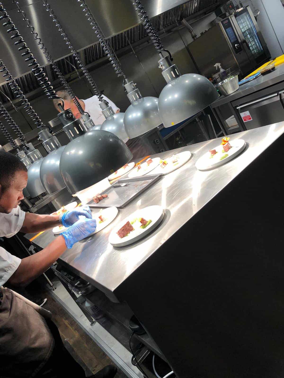 Chefs plating at The Gastronomist Ashford