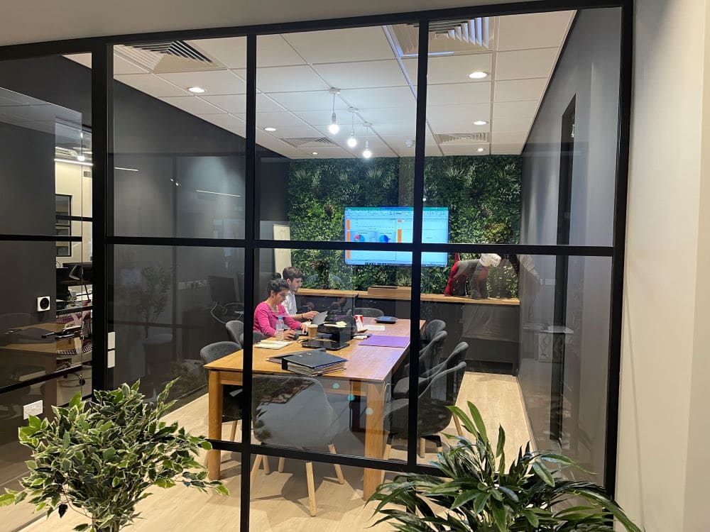 Meeting room with glass partition at The Snug, Ashford