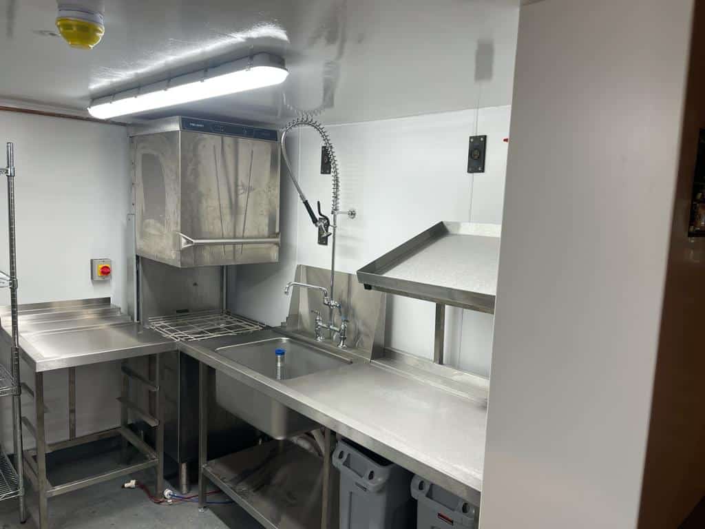 Wash-up area with hood dishwasher at The Tiger Inn, Stowting