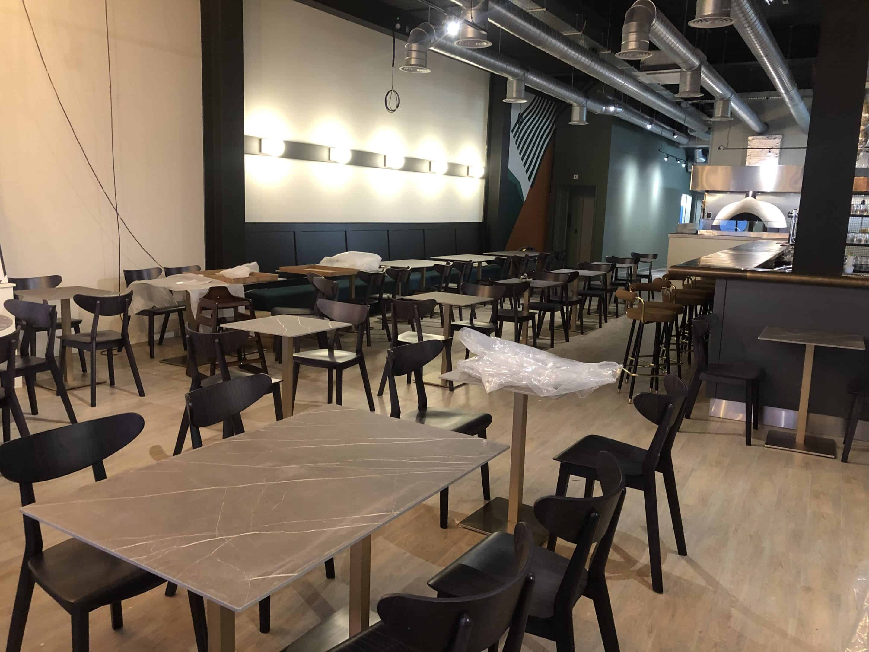 Dining area with wood-fired oven at Unita Quattro, Ashford