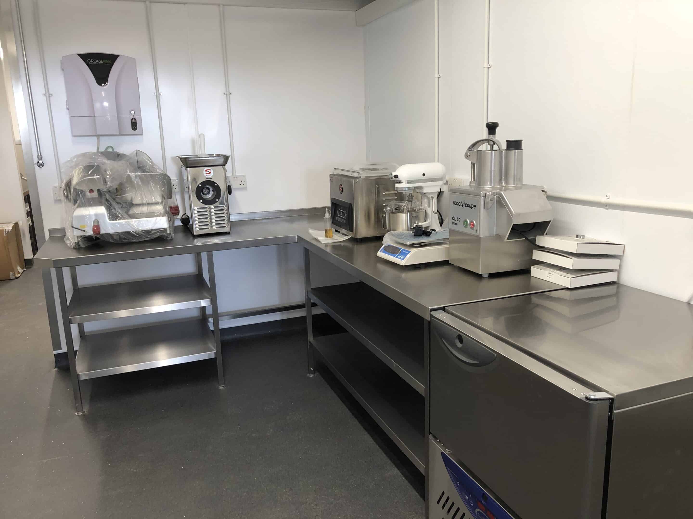 Prep room with Robot Coupe food processor at Unita Quattro